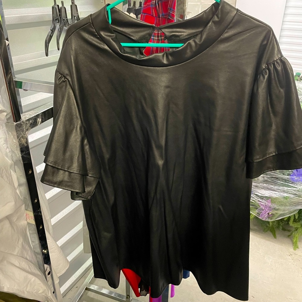 Vamp Faux Leather blouse with bell sleeves and 2 button closure in rear